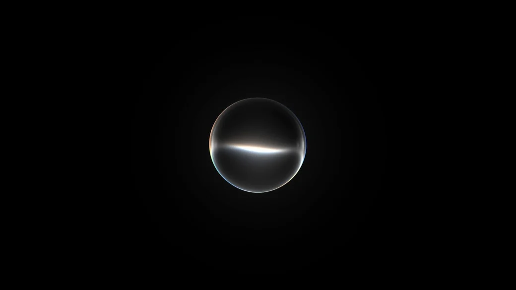 The glowing Siri AI orb, a glass sphere with a band of light across its middle, on a black background